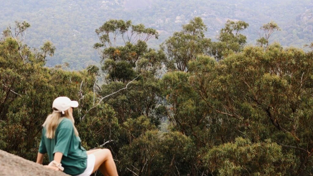 A woman admiring nature on a cliff