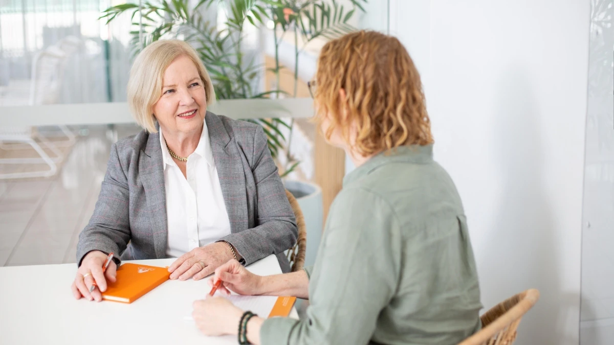 akyra-15-years Founder of Akyra, Margaret Goody, with a client