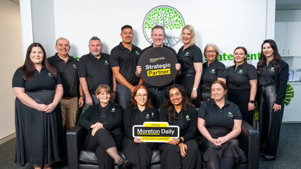 Employees of Bountiful Wealth celebrating their strategic partnership with Moreton Daily Group