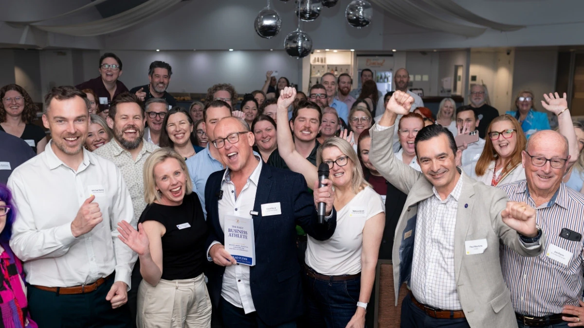 attendees at the Spring Moreton Daily Business Circle posing for a group photo with guest speaker Brad Flynn, who announced his newest bestselling book "The Daily Business Athlete"