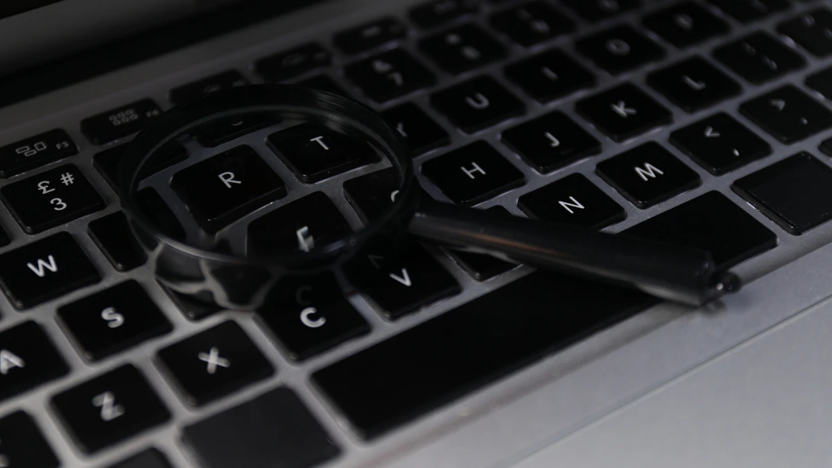 a magnifying glass on a keyboard