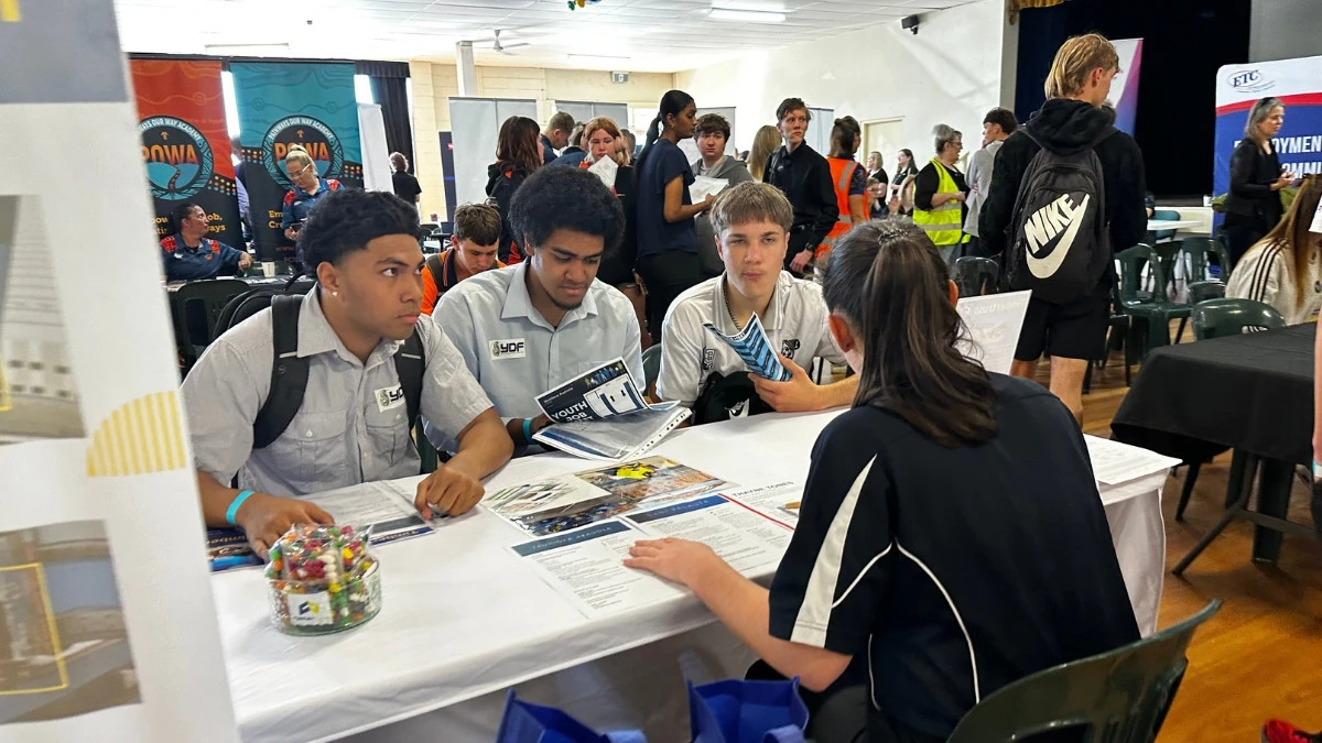students from the Youth Development Foundation speaking to a potential employer at the Youth Job Meet