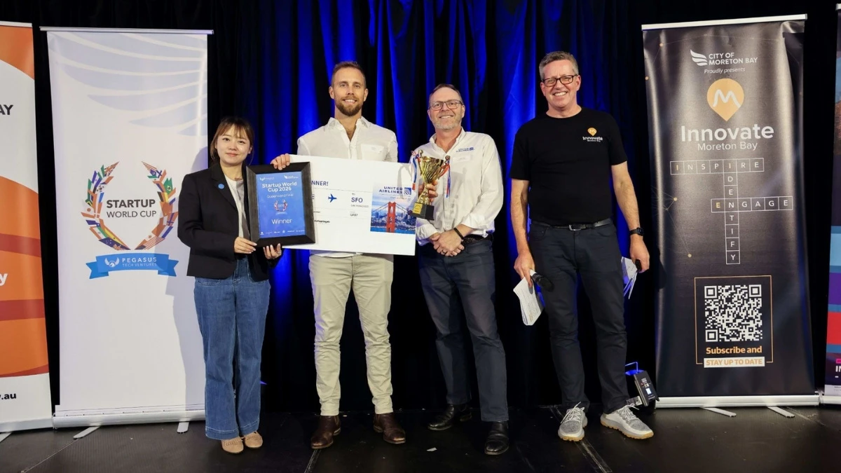 innovate moreton bay qld winner Nathan Denchman holding up his trophy and ticket to the Startup World Cup Grand Final in San Francisco