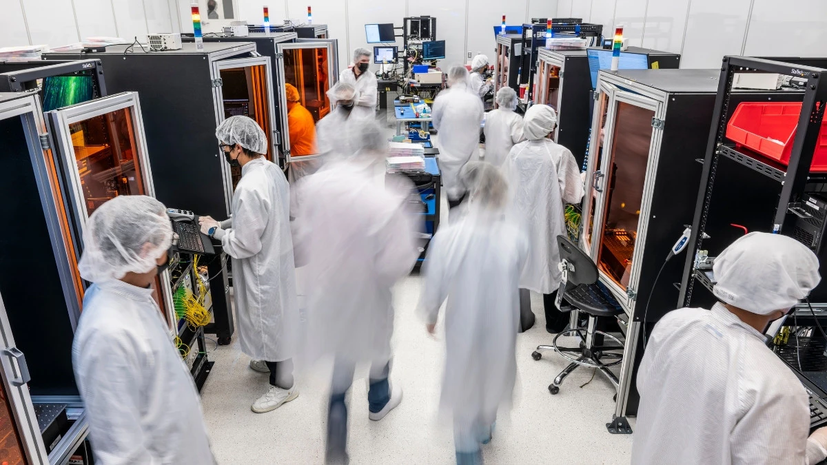 Workers assembling parts at a PsiQuantum factory